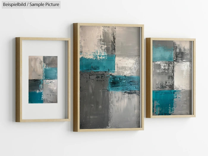 Abstract artwork with teal, gray, and beige geometric patterns in wooden frames on a white wall.