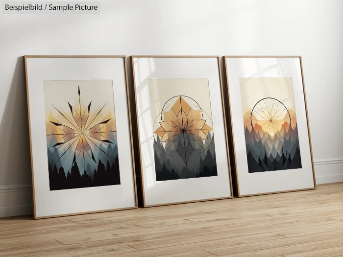 Three framed geometric art prints with mountain motifs on a wooden floor against a plain wall.