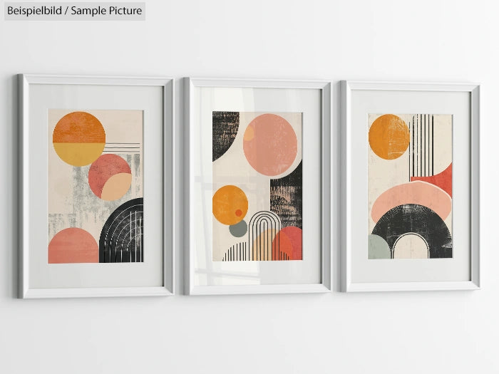 Three framed abstract artworks with geometric shapes in orange, pink, and black hues on a white wall.