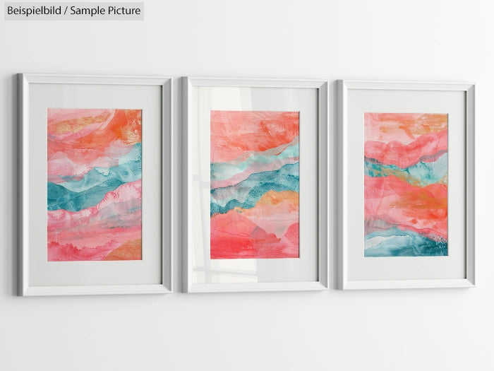 Three abstract watercolor paintings with pink, orange, and turquoise hues in white frames on a white wall.