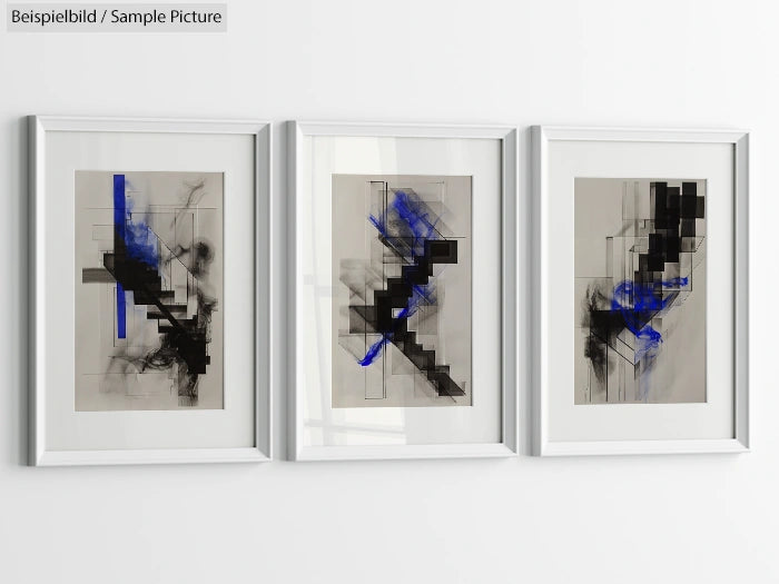 Triptych of abstract art with black and blue geometric designs in white frames on a wall.