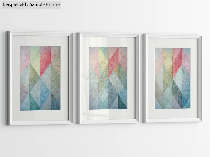 Triptych of abstract geometric paintings with pastel shades in framed white frames on a white wall.