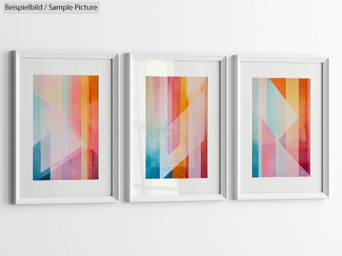 Set of three framed abstract paintings with colorful geometric shapes on a white wall.